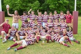 FSU Rugby team posed with championship trophy after a match
