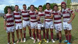 FSU Rugby players holding a championship trophy